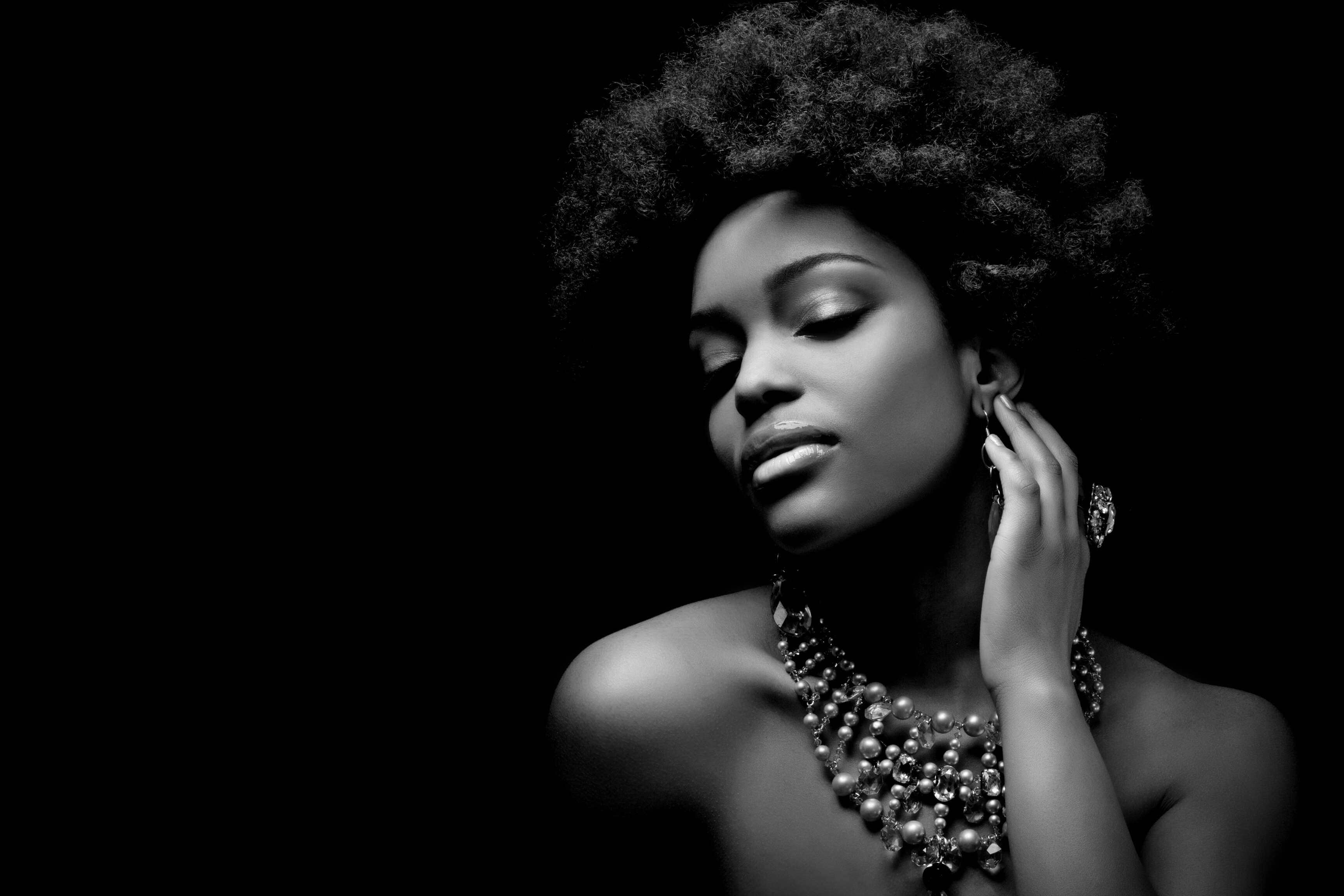 sensual black woman wearing luxury necklace